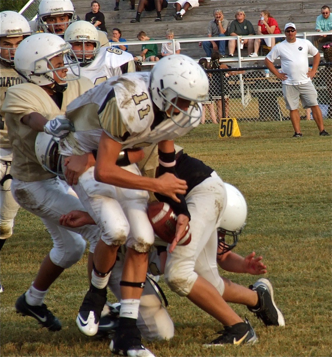 Image: Fabian Cortez(22) and Joseph Celis(6) cause Hubbard to fumble the ball away.