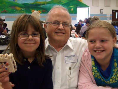 Image: David South sharing a big lunch with his granddaughters Katie South and Sydney Lowenthal.
