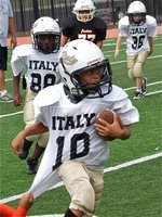 Image: Italy’s Laveranues Green(10) breaks several tackles on his way to a 55-yard game tying touchdown against Ferris in the first half of the bantam game.