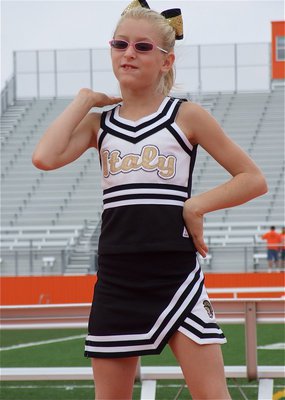 Image: IYAA B-Team cheerleader Courtney Riddle gets her groove on during a cheer. 
