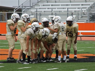 Image: Quarterback Tylan Wallace(2) calls the play out to his IYAA A-Team’s (5th &amp; 6th) offensive huddle.