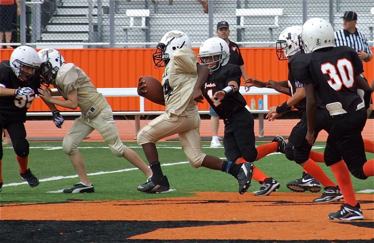 Image: Taron Smith(34) follows Ryder Itson(6) thru a nest of Yellow jackets.