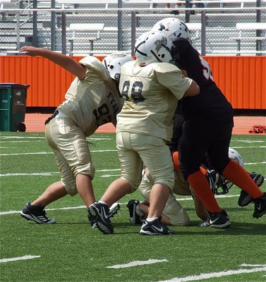 Image: Taking care of the Ferris defensive line are Austin Lowe(93) and Alex Garcia(98).