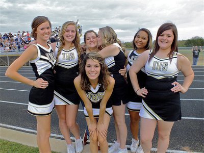Image: The Italy High School cheerleaders stand with their beloved cheer coach, Clover Stiles.