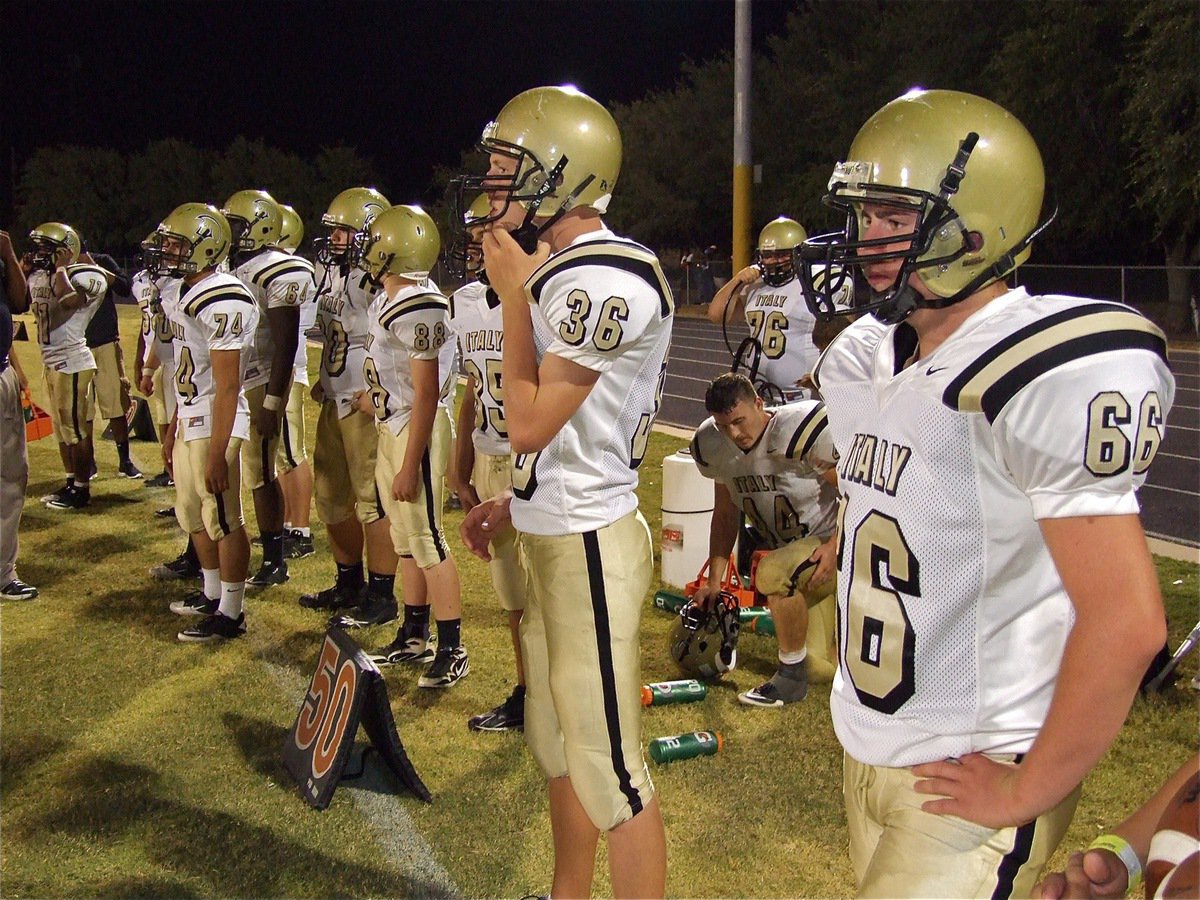 Image: Mixed in with the varsity squad for Friday night’s game in Hubbard are members of The Dirty Dozen, Italy’s JV team that suited up to help take on Hubbard.