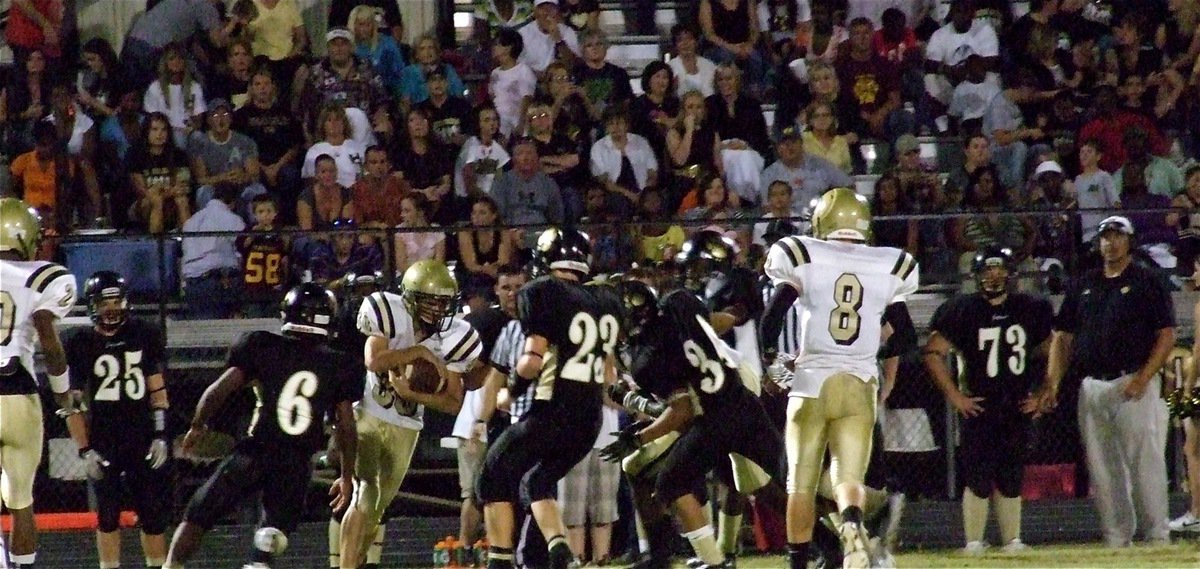 Image: Sophomore Justn Wood(30) hauls in the fair catch with the entire Hubbard Jaguar sideline and bleachers breathing down the back of his neck. Not bad for a rookie!