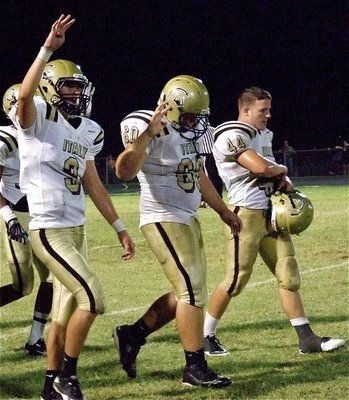 Image: Jase Holden(3), Kevin Roldan(60) and Ethan Saxon(44) are excited to play the fourth quarter.