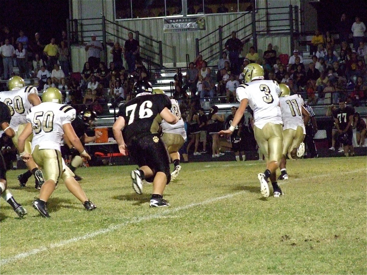 Image: Going around the end is Jalarnce Jamal Lewis(11) who scored a rushing touchdown for the Gladiators.