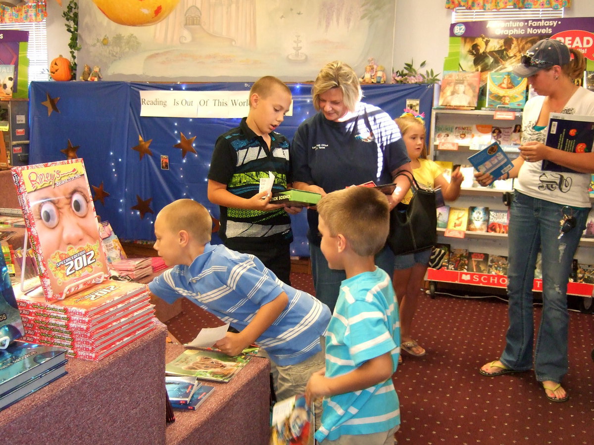 Image: Everyone is busy looking at all the books.