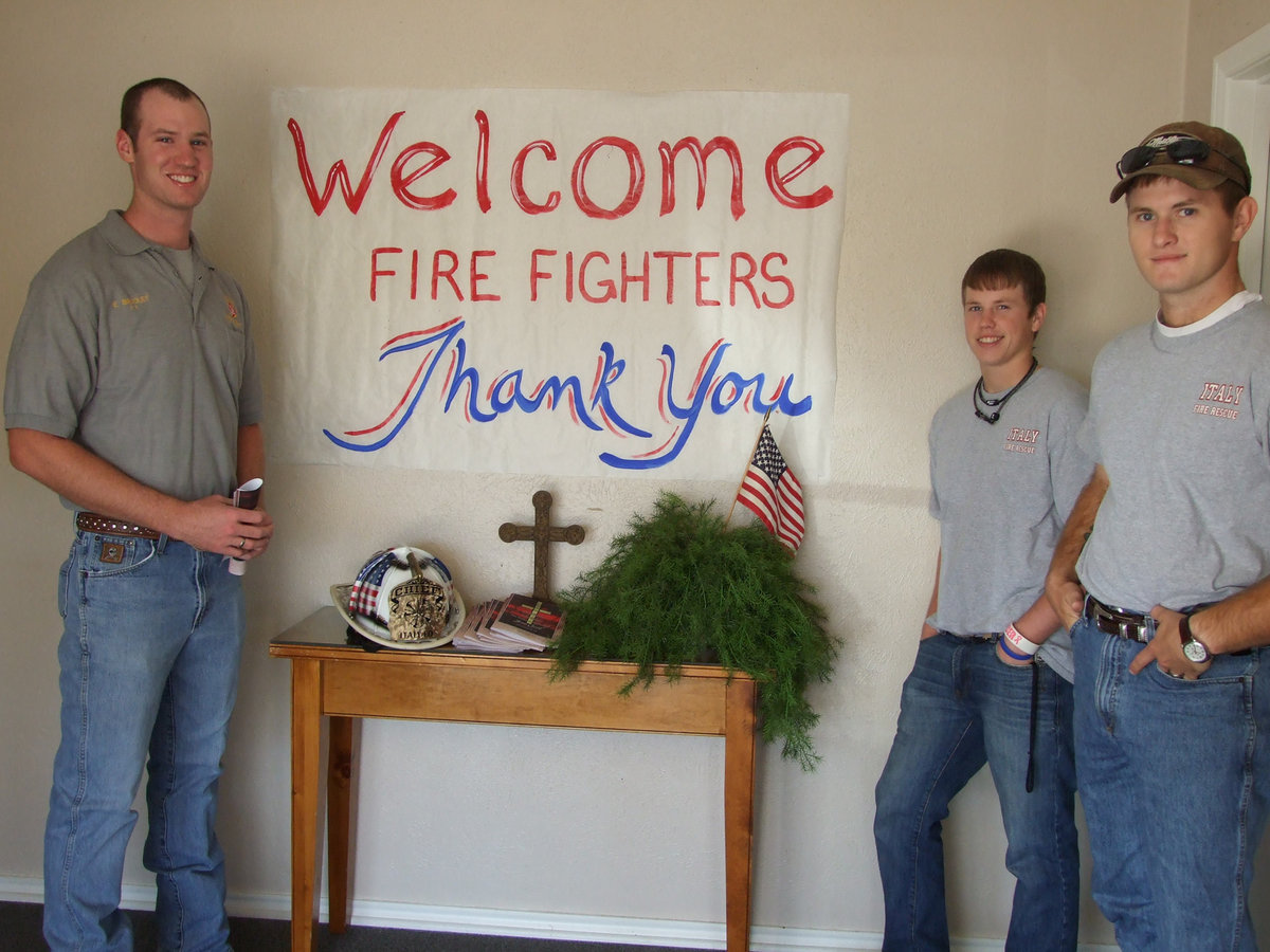 Image: Eric Bradley, Justin Buchanan and Matthew Brannon welcome family and friends to First Baptist Church on September 11.