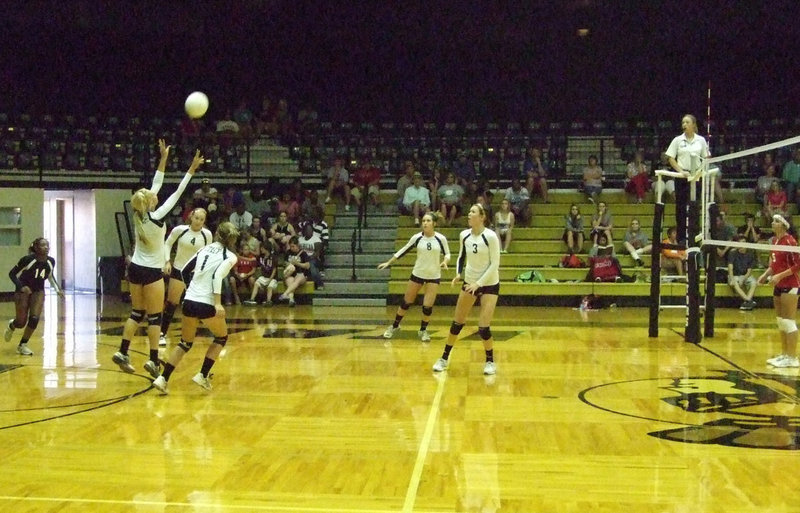 Image: 
    	Megan Richards sets up for the score.
    