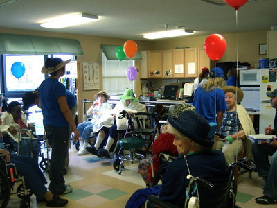 Image: All kinds of hats Trinity Mission staff and residents.