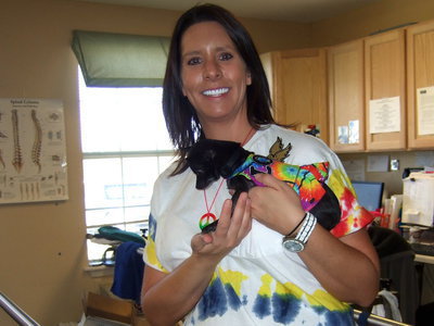 Image: Even Lisa Marie (therapy dog) is decked out in tie-dye.