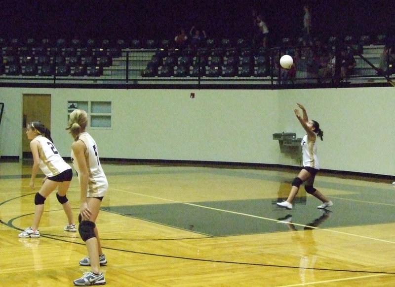 Image: Lady Gladiator 8th grade volleyball team took on  the Lady Panthers.  Jozie Perkins, Halee Turner and Ashlyn Jacinto are prepared for this game.