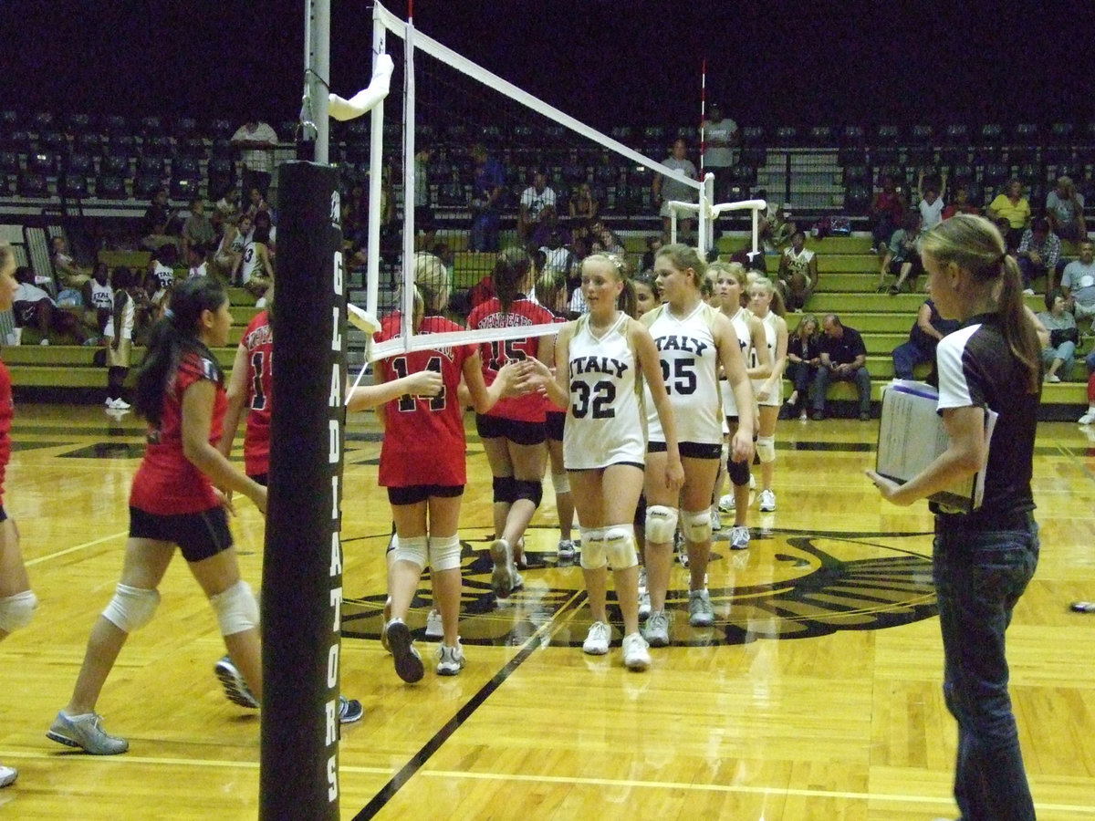 Image: Coach Reeves watches the Lady Gladiators after the game, good sportsmanship can be seen.