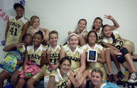 Image: “Victory is ours” says the Lady Gladiator 7th grade.  With a tournament win under their belt, they are flying high.