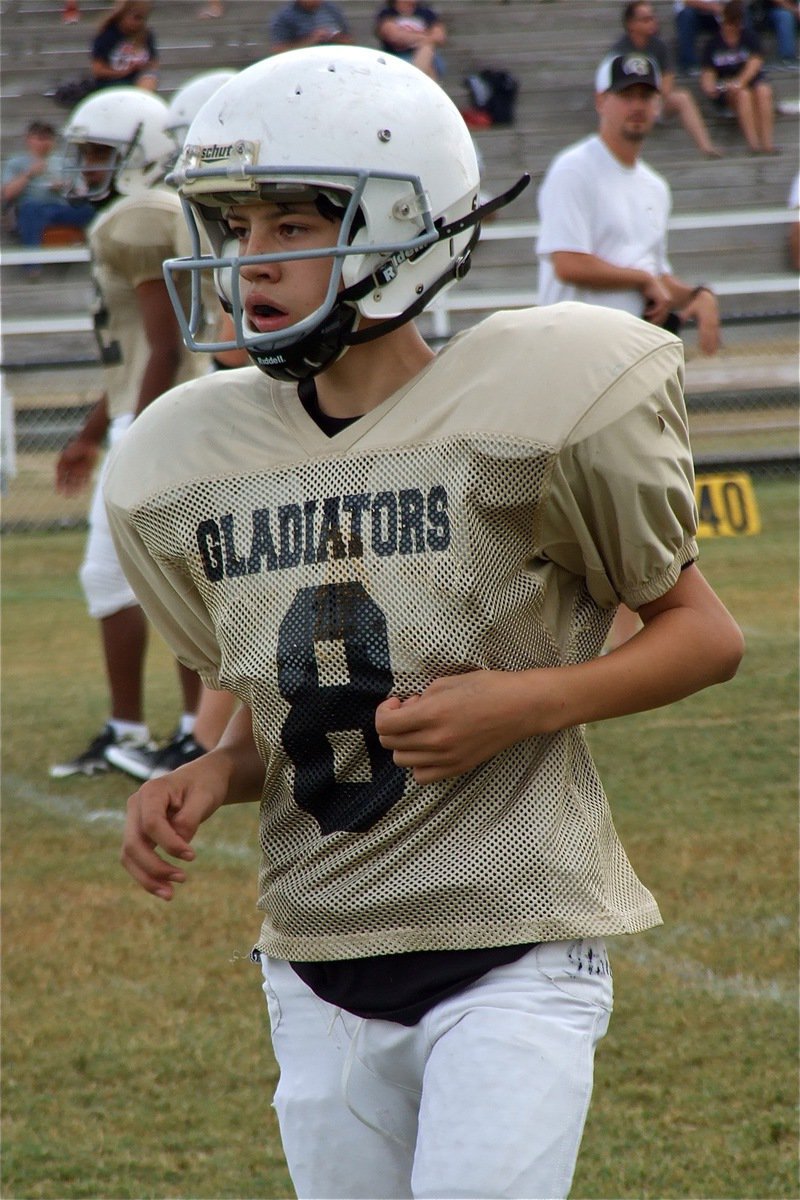 Image: Darren Cisneros runs a few pass routes before the game.