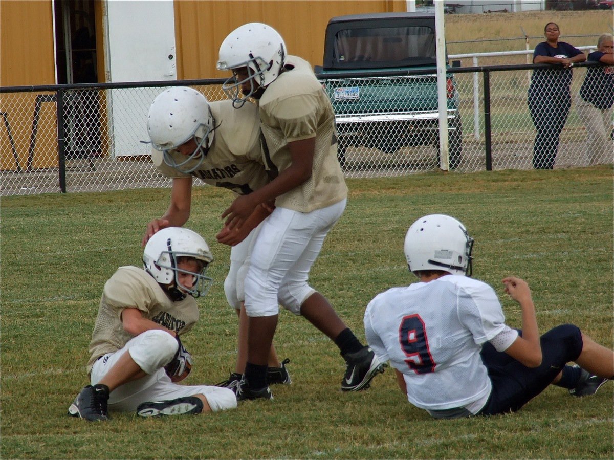 Image: Italy’s Levi McBride(28) gets congratulations from his teammates after intercepting the Mustang’s. 