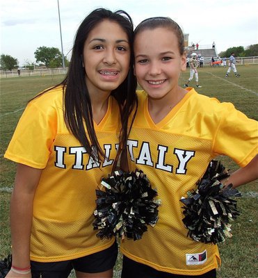Image: IJH Cheerleaders Elizabeth Garcia and Paige Little add beauty to the brawn. 