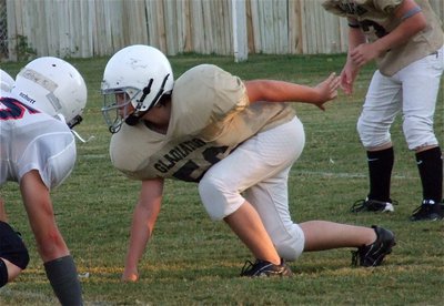 Image: Left defensive tackle Elliot Worsham(56) tries to get a jump on the Mustang snap.