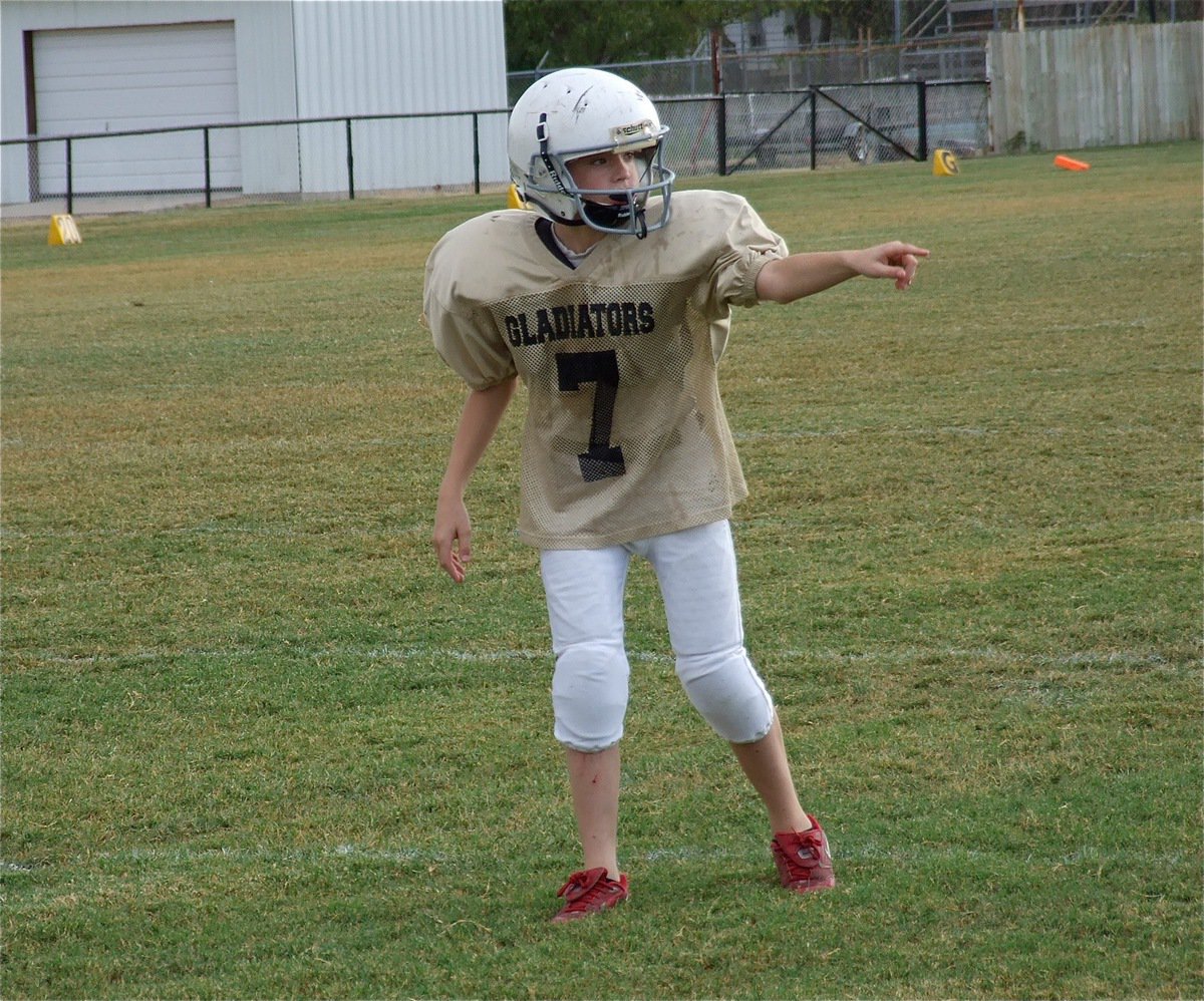 Image: Dylan “Red Shoes” McCassland checks with the side judge for alignment.