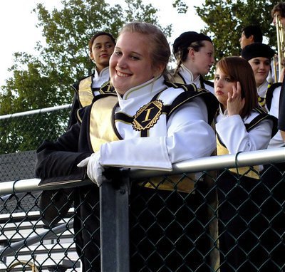 Image: Gladiator Regiment Marching Band and Flag Corp drum major, Drenda Burk, does her job with a smile.