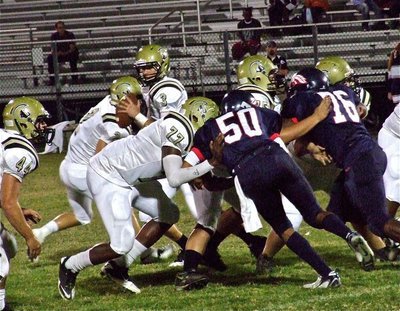 Image: Gladiator offensive lineman Larry Mayberry, Jr.(77), Kelton Bales(75) and Zain Byers(50) keep quarterback Jase Holden protected