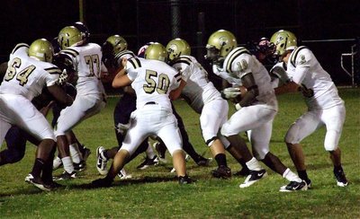 Image: Gladiator offensive lineman Adrian Reed(64), Larry Mayberry, Jr.(77), Zain Byers(50) and Kelton Bales(75) fence in the Mustang defense allowing Ryheem Walker(10) to take the handoff from Jase Holden(3) and run in for another Italy touchdown.