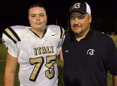 Image: Proud Gladiator head coach, Craig Bales, celebrates Italy’s 46-0 win over Red Oak Life with his son, Kelton Bales, who played in his first start on the varsity offensive line as a freshman right guard.
