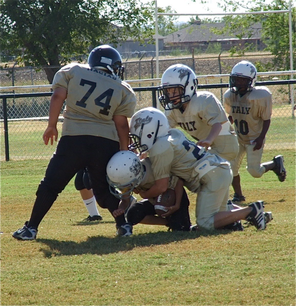 Image: Italy’s Gage Wafer(24) makes the tackle on Palmer’s running back during the B-team game.