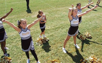 Image: IYAA A-team cheerleaders show their Gladiator might on the sidelines.