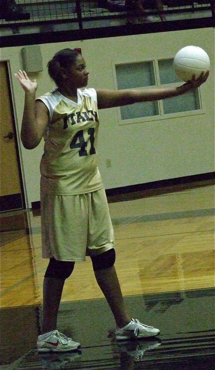 Image: 7th Grader Oleshia Anderson(41) prepares to serve for Italy.