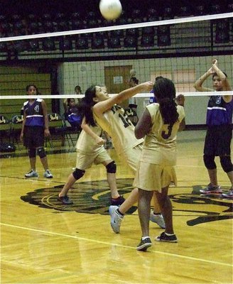 Image: 7th Graders Lizzie Garcia(12) and Moesha Griffin(3) keep the ball alive.