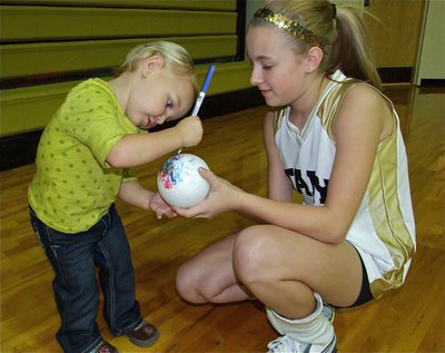 Image: Acee Richters signs her autograph for 8th Grader Brittany Chambers.