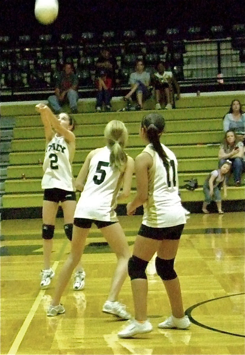 Image: Cassidy Childers(2) sends one back over the net.