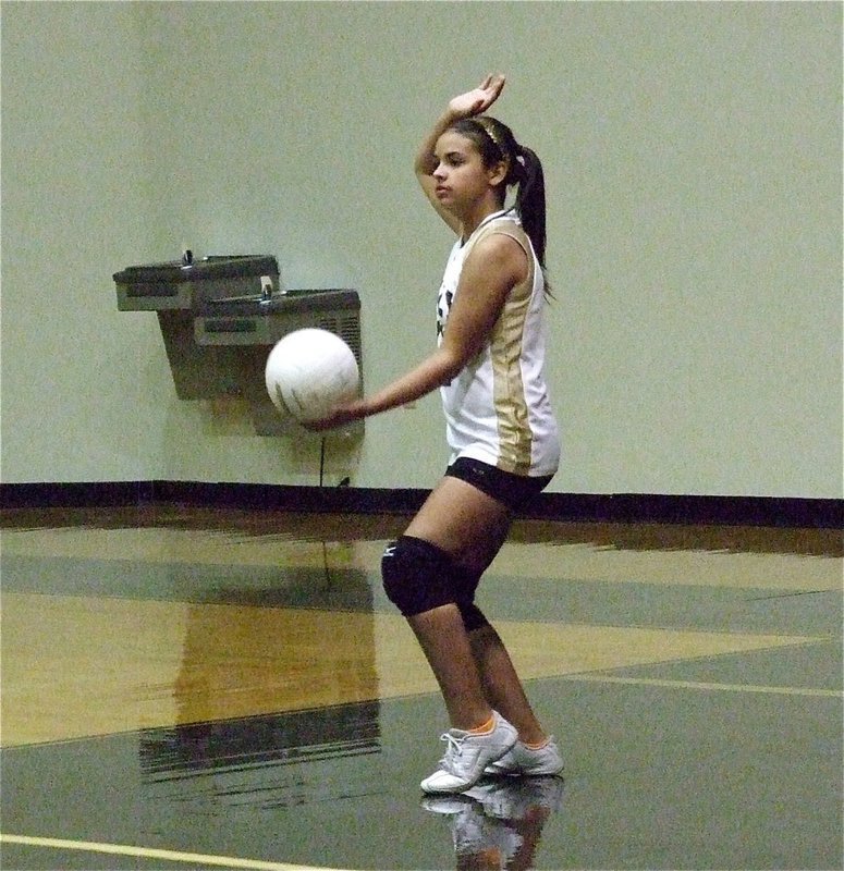 Image: Ashlyn Jacinto(11) lines up the serve.