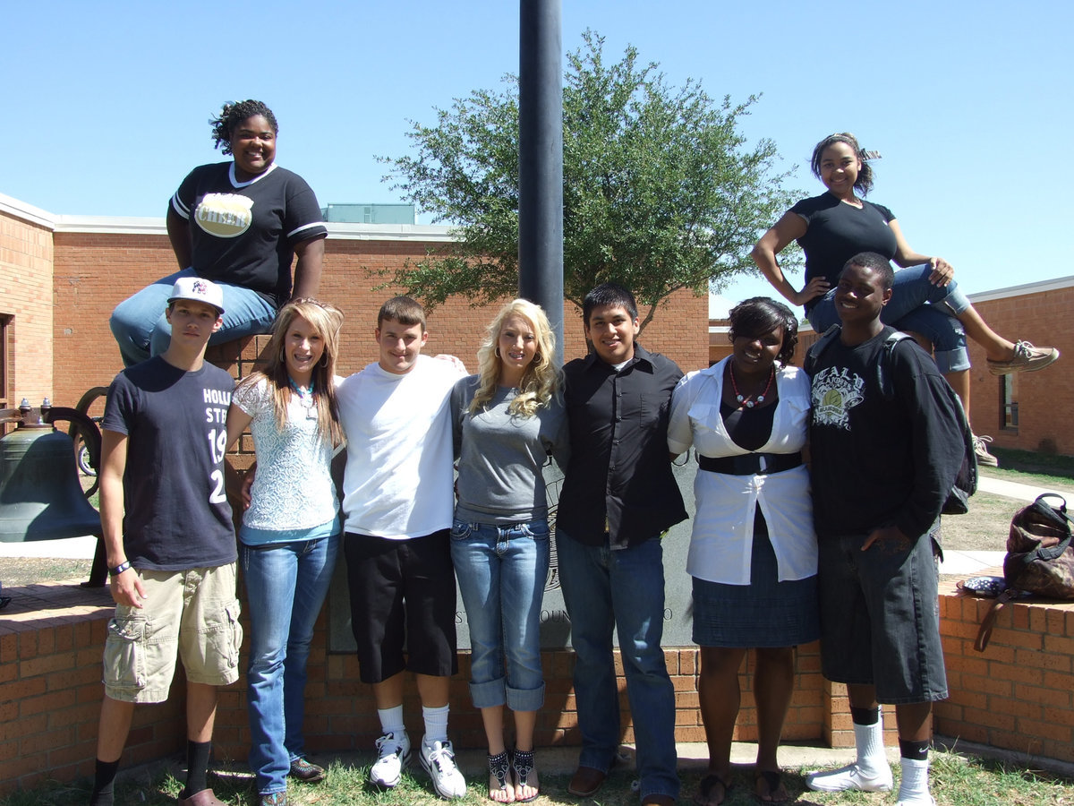 Image: IHS Homecoming Queen and King nominees gather in front of their school for a quick picture. (Not pictured is king nominee, Brandon Souder)