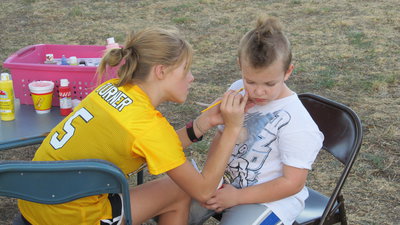 Image: Face painting was offered by the Italy Jr. High cheerleaders.