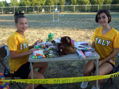Image: Italy Jr. High cheerleaders, Paige Riddle and Kasey Bales ready to hand out prizes to he winners of the games.