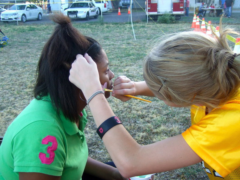 Image: Haley is at it again, this time it is a heart she is painting.