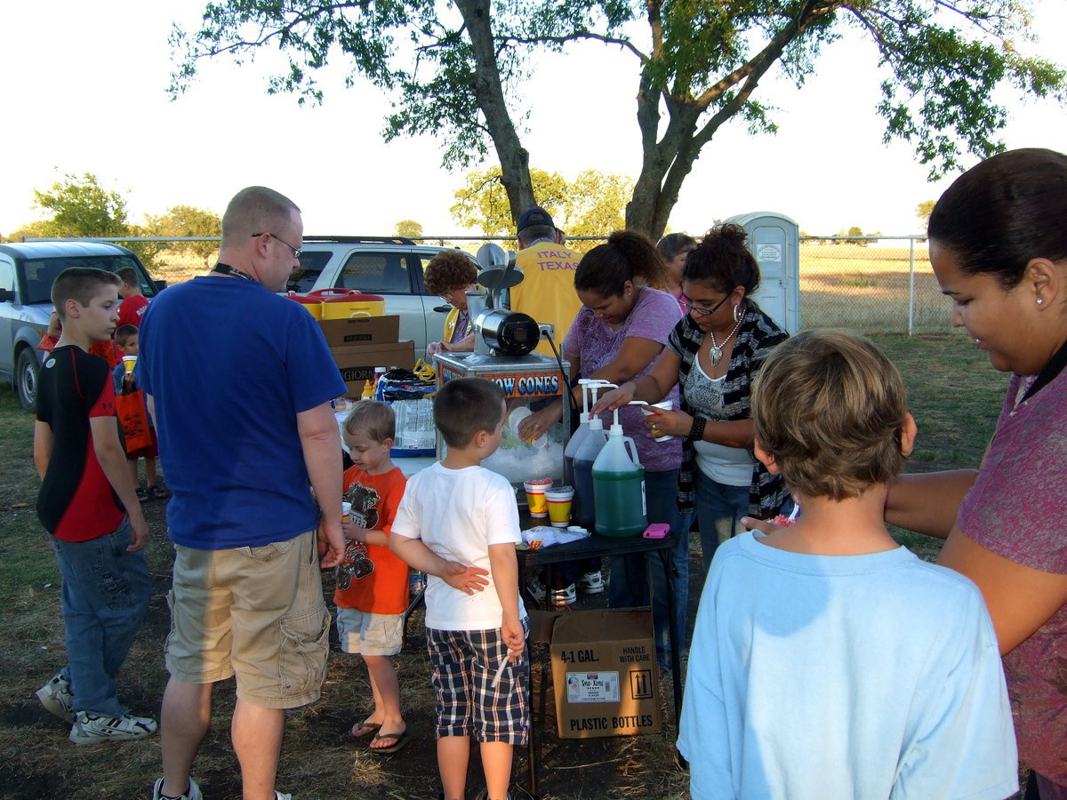 Image: The snow cone booth is hopping with customers.