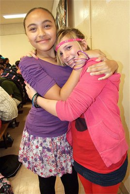 Image: Vanessa Cantu and Sarah Levy hold on tight during 80’s Day at Italy High School.