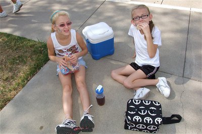 Image: Courtney Riddle and Madelyn Chambers enjoy their lunch break during the IYAA Cheer Camp.