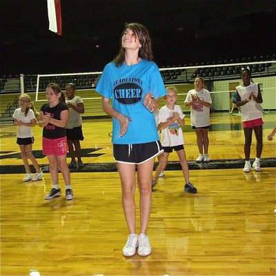 Image: IHS Cheerleader Beverly Barnhart walks the campers thru their dance steps.