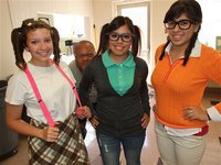 Image: Morgan Cockerham, Yesenia Rodriguez and Alma Suaste show off their Nerd Day duds. Larry Mayberry, Sr. is not happy about being left out of this cool clique.
