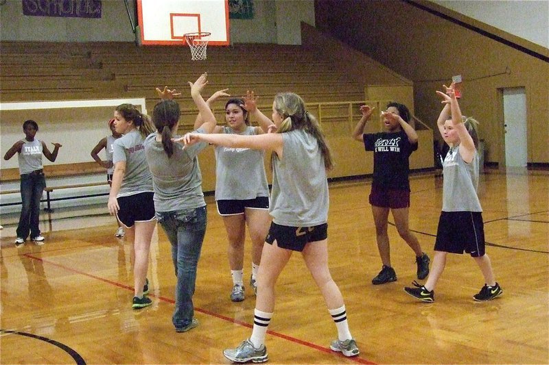 Image: The girls’ side celebrates a point.