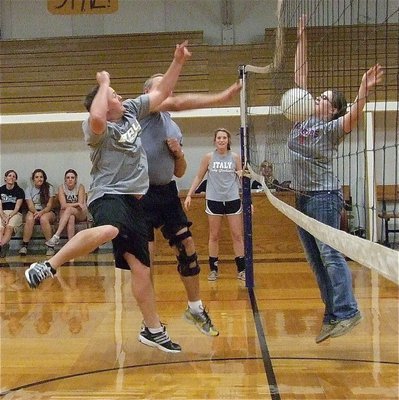 Image: Displaying their awesome athlete-like skills, coaches Josh Ward and Randy Parks some how manage to score while Reagan Adams was mesmerized by their low-flying talents.