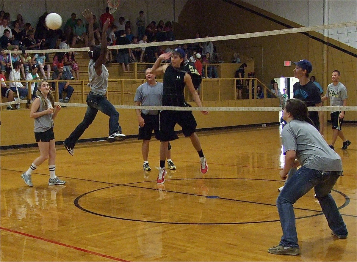 Image: Kourtnei Johnson  attempts to block Cole Hopkins at the net.