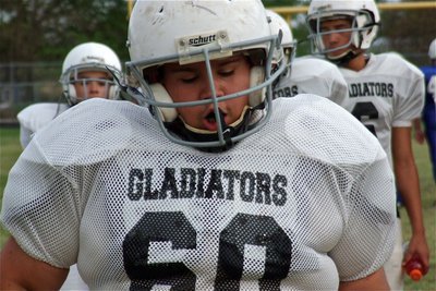 Image: Adrian Acevedo(60) gets work done at right guard for the Jr. High Gladiators.