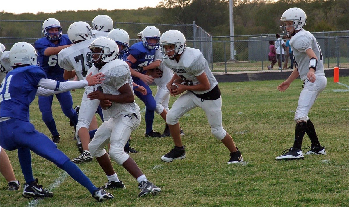 Image: Joe Celis(6) takes the handoff from Ryan Connor(17) and then looks for a lane.